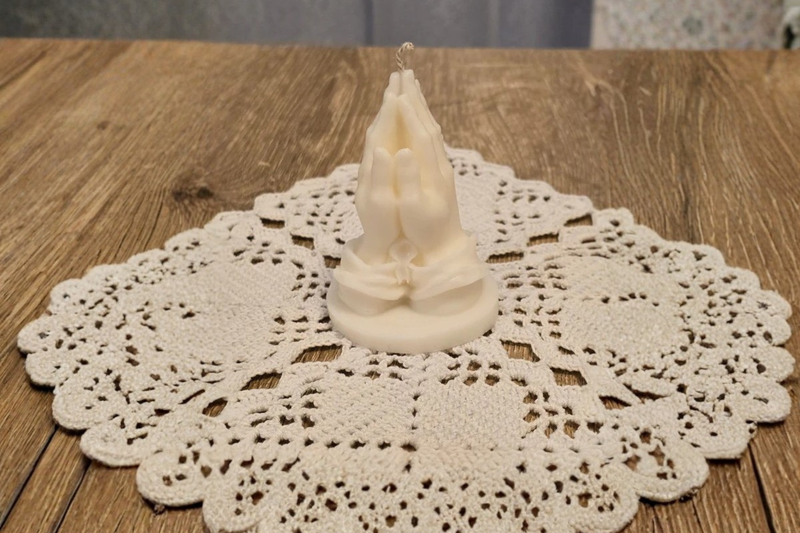 Candle With Praying Hands Meaning with Patterns Symbols and Traditions